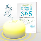 ZenSpire + allumé en jaune devant le livre Cohérence cardiaque 3.6.5 du Dr David O’Hare