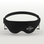 Masque de sommeil noir ZenSpire avec bouchons d'oreilles, vu de face sur un fond gris clair